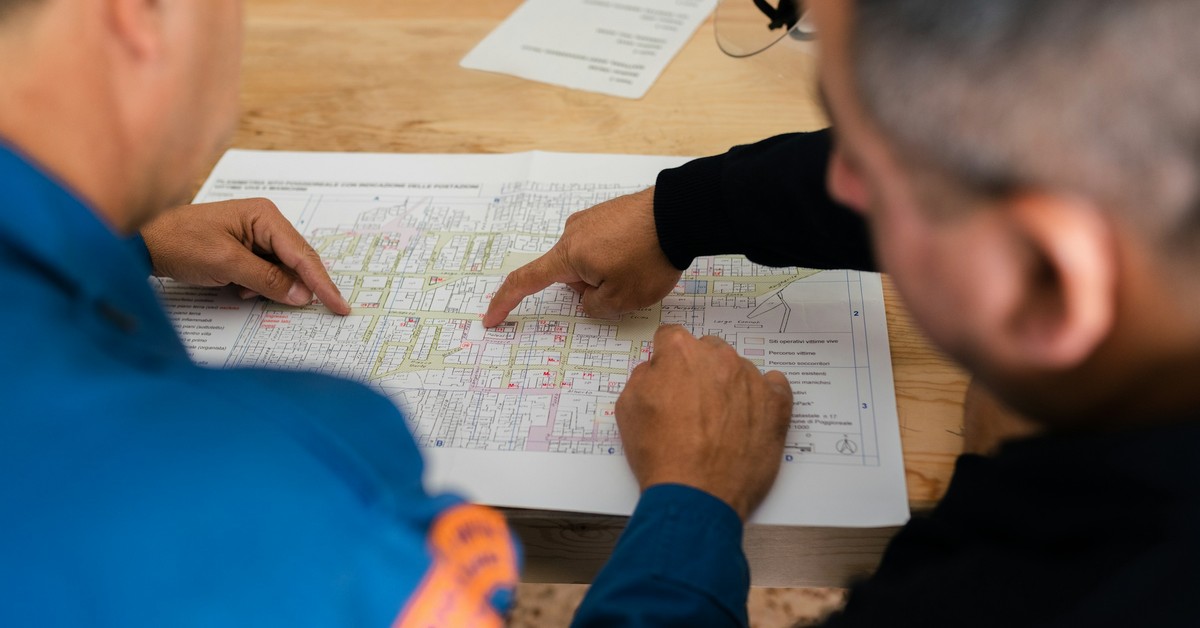 Two professionals reviewing plans, representing skilled occupations on Australia's MLTSSL and STSOL