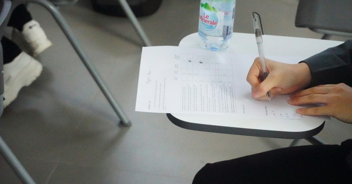 Candidate writing an English language test such as IELTS or PTE for Australia PR points